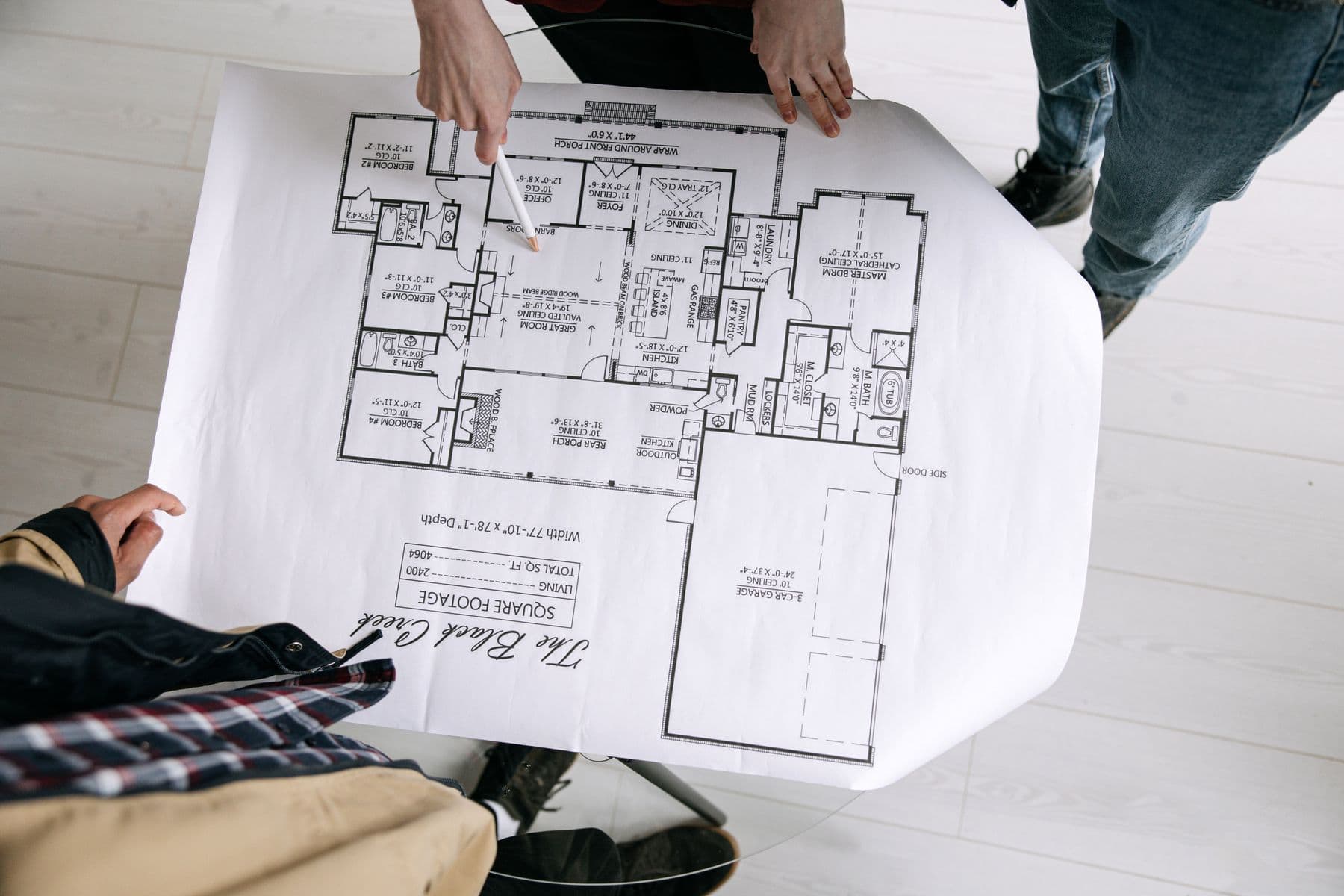 People reviewing a residential floor plan together