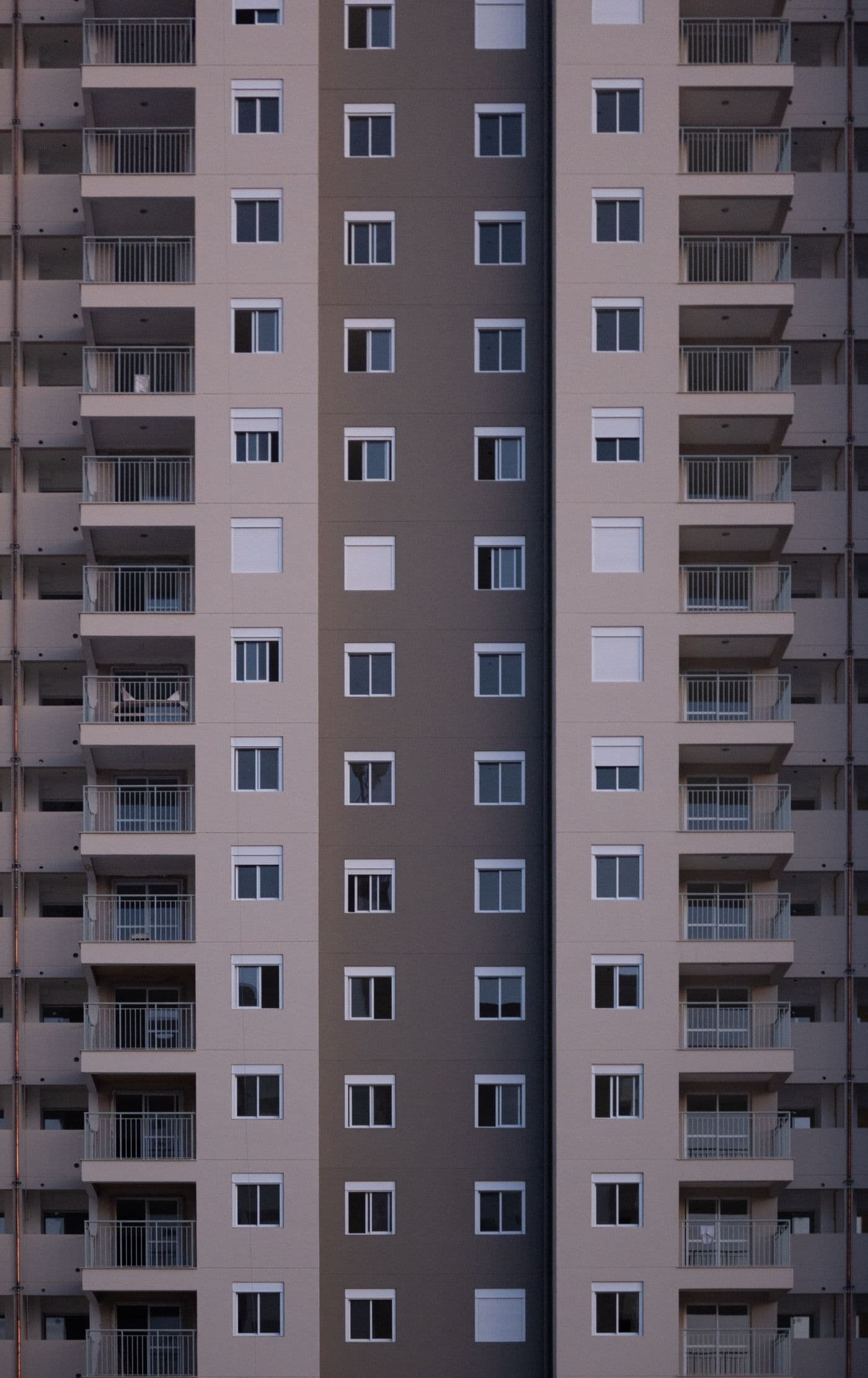 The symmetrical exterior of a multi-unit residential building